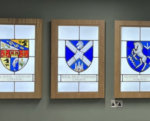 Crests of veterinary colleges rendered in stained glass